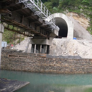 The bridge across the Mzymta river on the railway line Adler - Alpika Service Mountain Resort. 